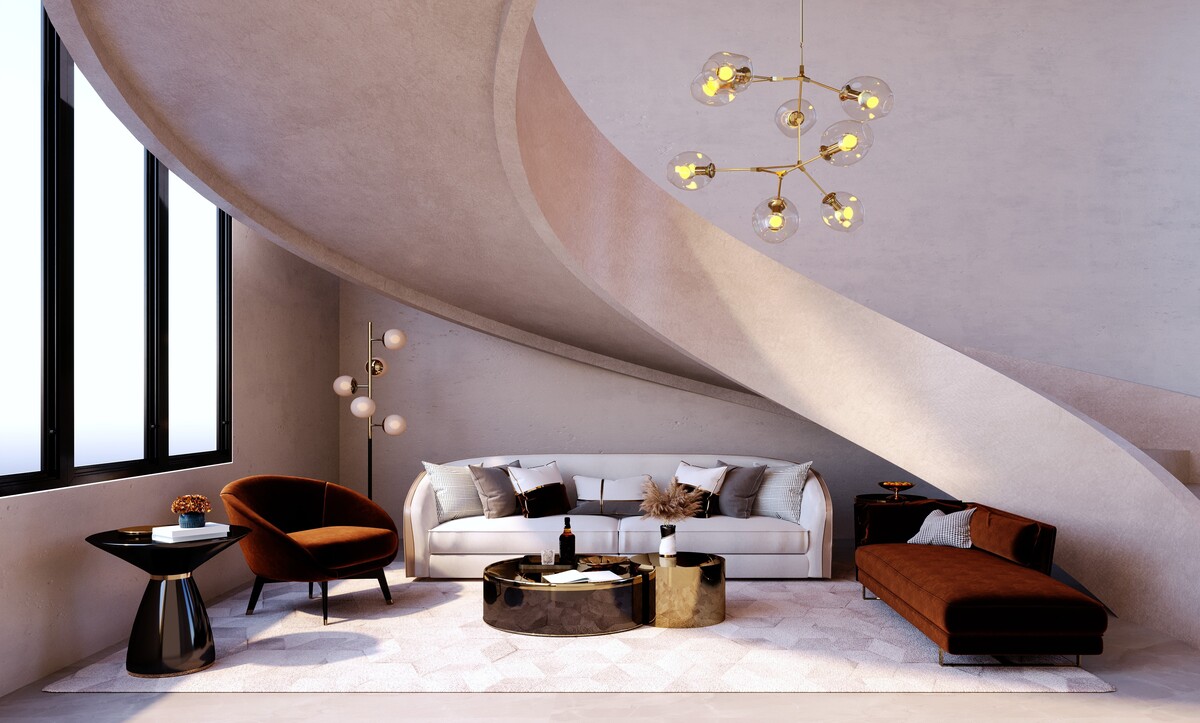 Seating area under a sweeping plaster staircase with globe chandelier